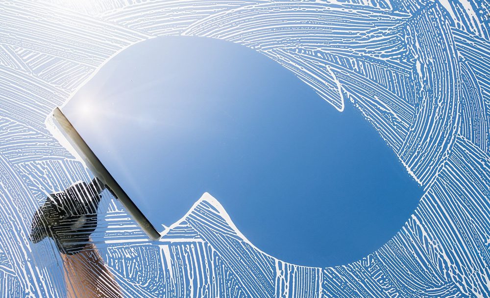 Squeegee leaving a clean streak on glass